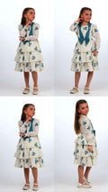 TRENDT MODA ÖNÜ FİYONKLU İNCİLİ ASTARLI KREM ÜZERİNE MAVİ ÇİÇEKLİ ELBİSE
