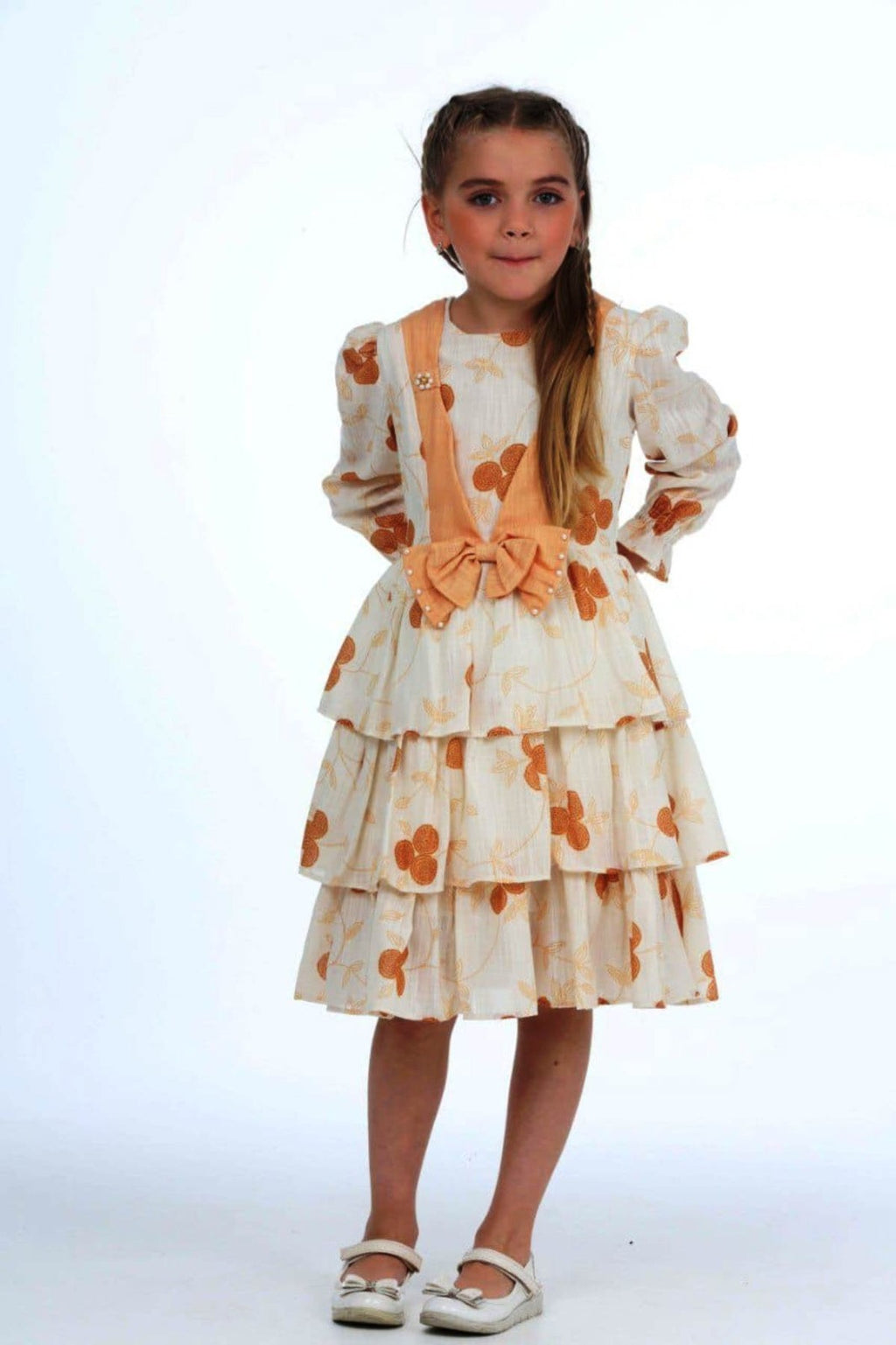TRENDT MODA ÖNÜ FİYONKLU İNCİLİ ASTARLI KREM ÜZERİNE SARI ÇİÇEKLİ ELBİSE